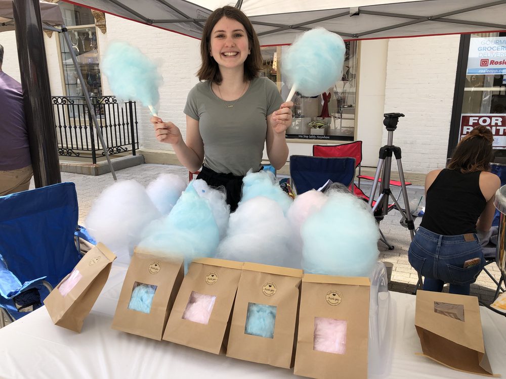 YEM student smiling at her market stall